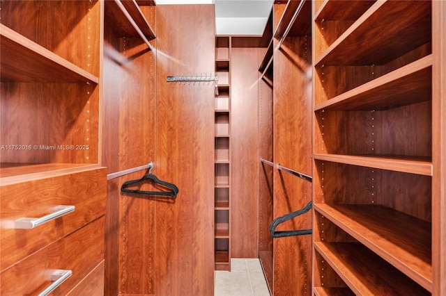 spacious closet featuring tile patterned floors