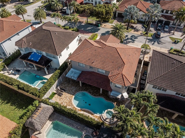 birds eye view of property with a residential view