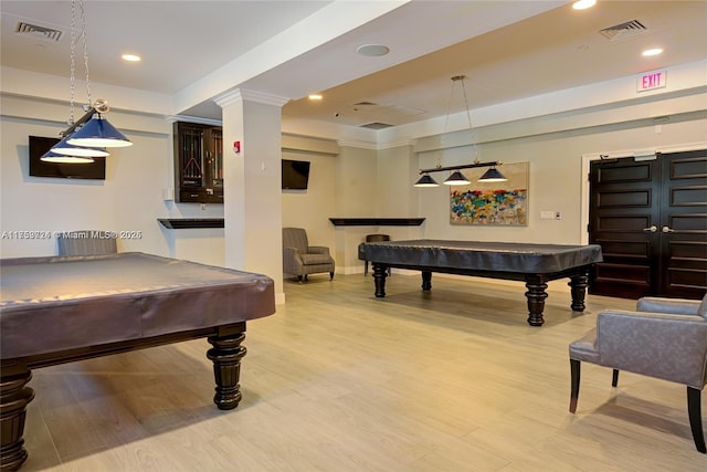 game room with light wood-style flooring, pool table, and visible vents