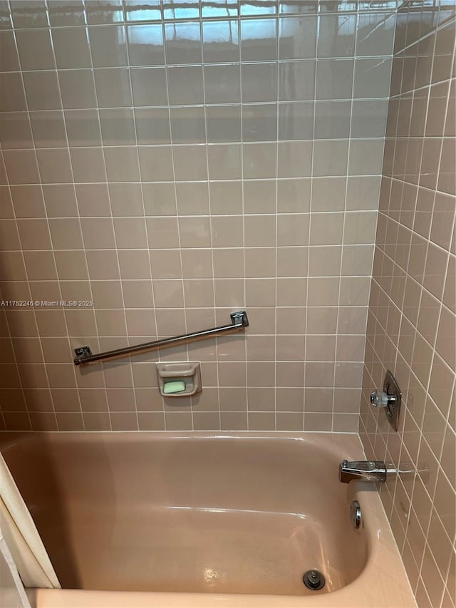 bathroom featuring washtub / shower combination