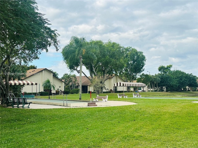 view of community with a yard