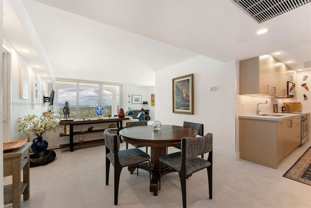 dining area featuring baseboards, light tile patterned floors, visible vents, and recessed lighting