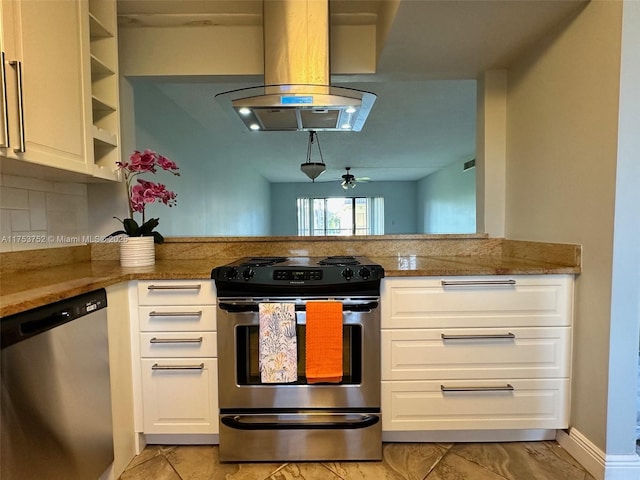 kitchen featuring white cabinets, a peninsula, light stone countertops, island exhaust hood, and stainless steel appliances