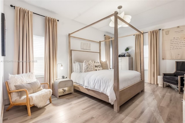 bedroom with light wood finished floors