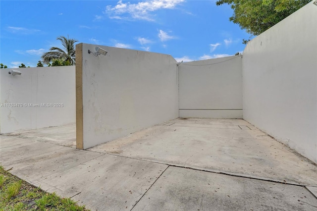 view of patio featuring fence