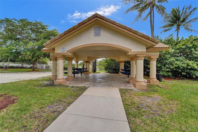 view of home's community with a lawn and a gazebo