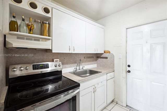 kitchen with under cabinet range hood, a sink, white cabinetry, light countertops, and stainless steel electric range oven