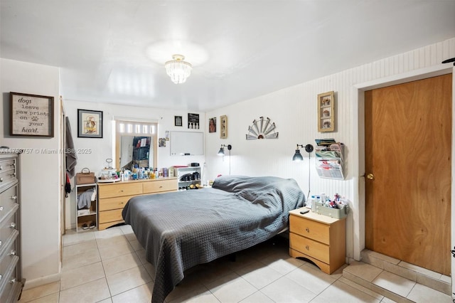 bedroom with light tile patterned floors