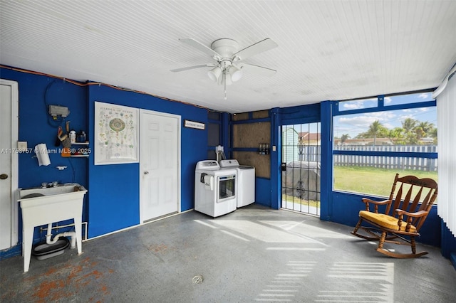 interior space featuring washing machine and dryer and a ceiling fan