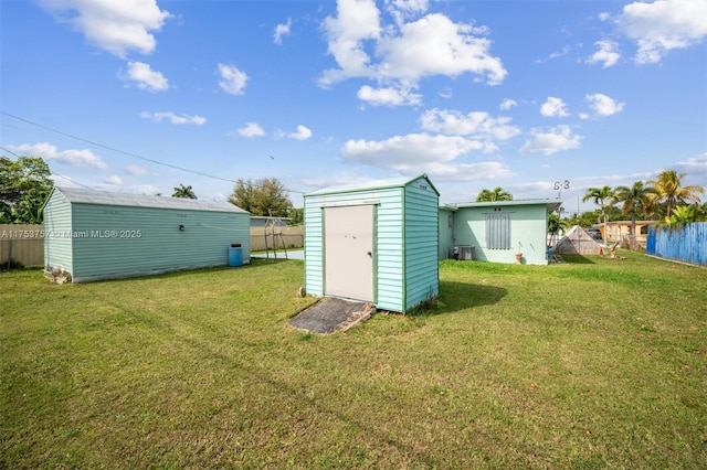 view of shed with fence