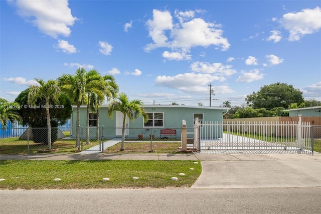 view of front facade with a fenced front yard, a gate, concrete driveway, and stucco siding