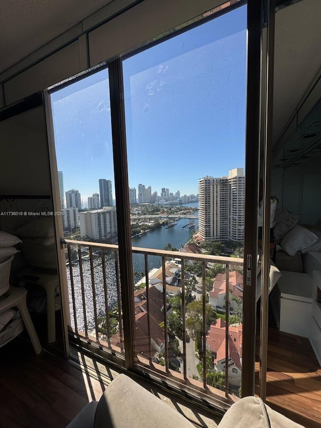 balcony with a city view and a water view