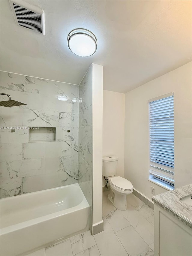 bathroom with toilet, vanity, visible vents, baseboards, and marble finish floor