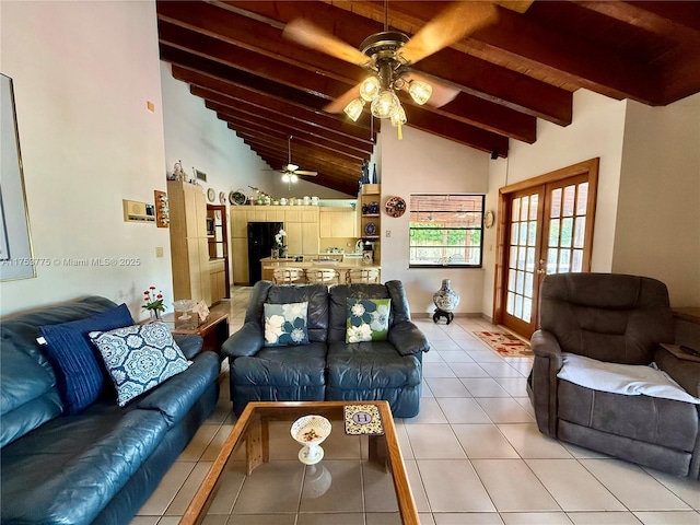 living area with light tile patterned floors, french doors, beam ceiling, and a ceiling fan
