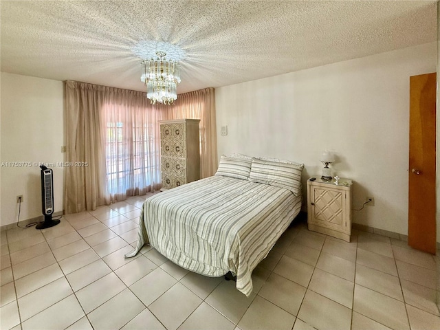 tiled bedroom with a textured ceiling and a notable chandelier
