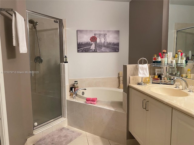 bathroom featuring tile patterned floors, a shower stall, vanity, and a bath