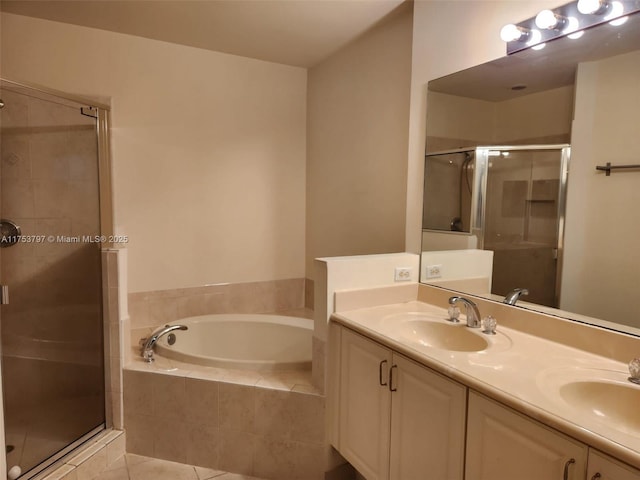 full bath with a garden tub, double vanity, a sink, and a shower stall