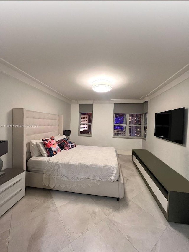 bedroom featuring marble finish floor