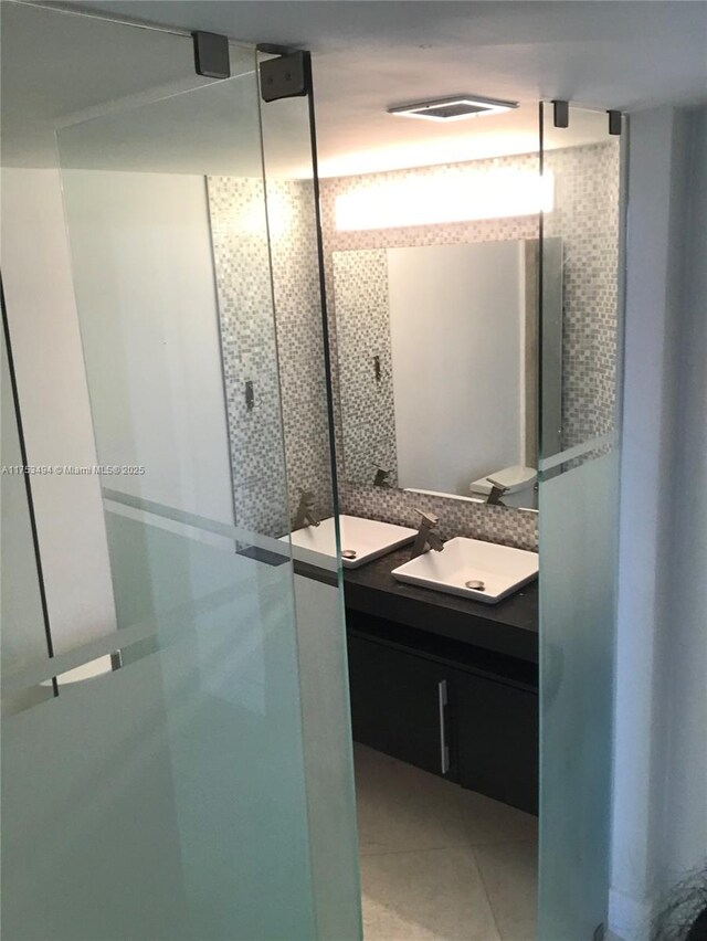 bathroom with vanity, visible vents, and tile patterned floors