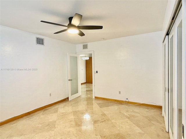 unfurnished bedroom featuring a closet, visible vents, ceiling fan, and baseboards