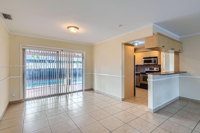 kitchen featuring light tile patterned floors, visible vents, appliances with stainless steel finishes, and crown molding