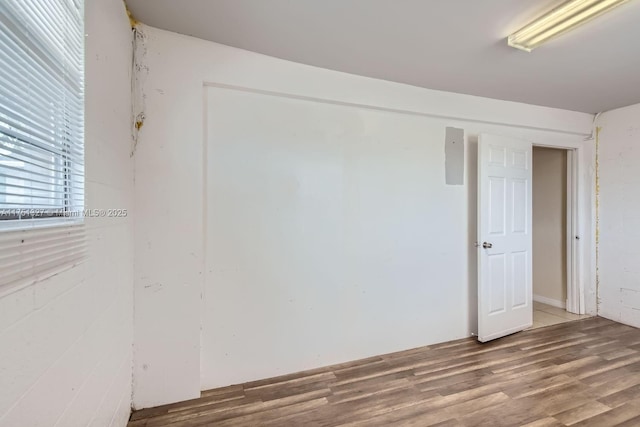 unfurnished room featuring wood finished floors