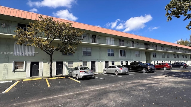 view of property featuring uncovered parking