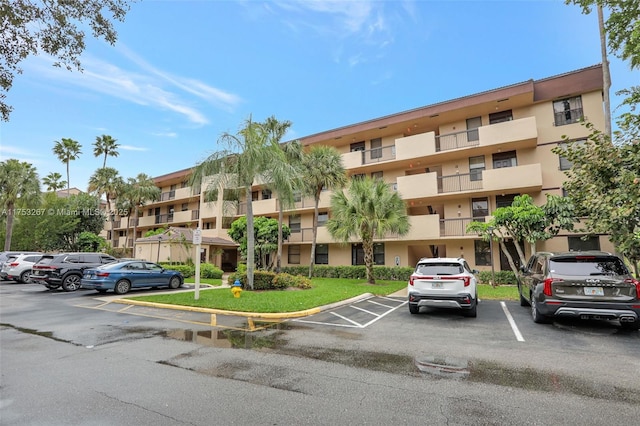 view of property with uncovered parking