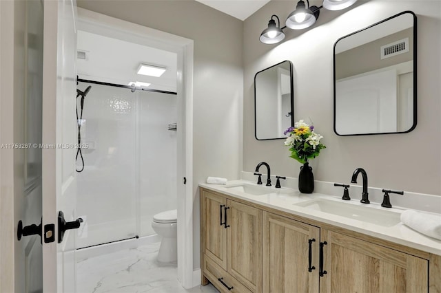 full bath with toilet, marble finish floor, a shower stall, and a sink