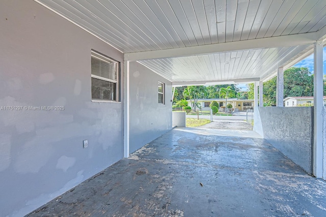 view of patio / terrace with an attached carport