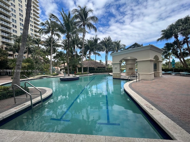 community pool featuring a patio area