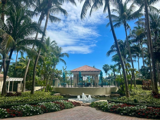 view of property's community featuring a gazebo and a pergola