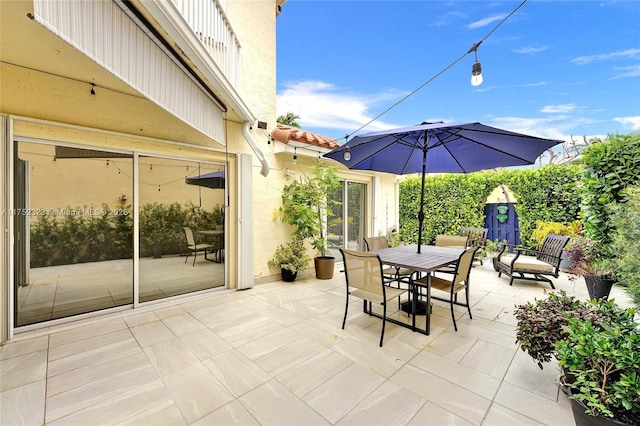 view of patio featuring outdoor dining area