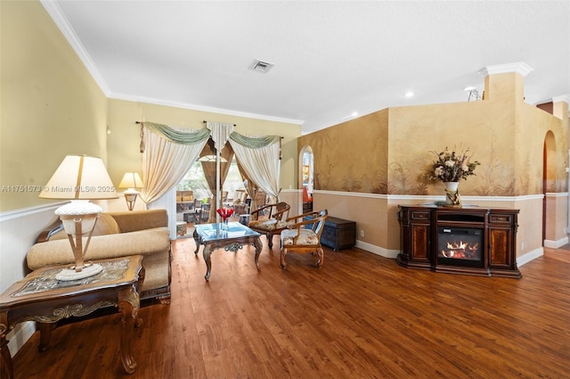 16358 S Mariposa Cir S, Pembroke Pines, FL 33331 - living area with baseboards, ornamental molding, a wainscoted wall, visible vents, and wood finished floors