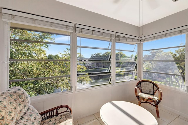 sunroom / solarium featuring a healthy amount of sunlight