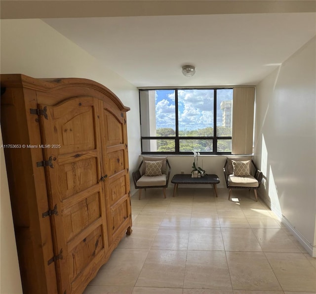 unfurnished room featuring light tile patterned floors