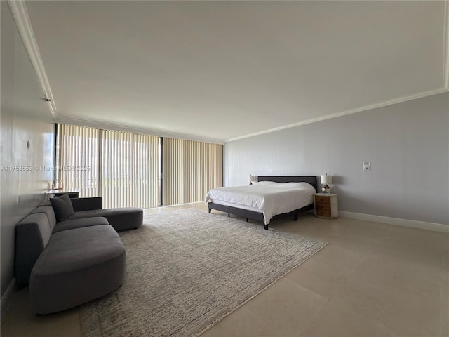 tiled bedroom featuring ornamental molding and baseboards