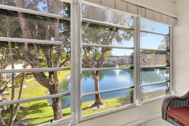 sunroom with a water view