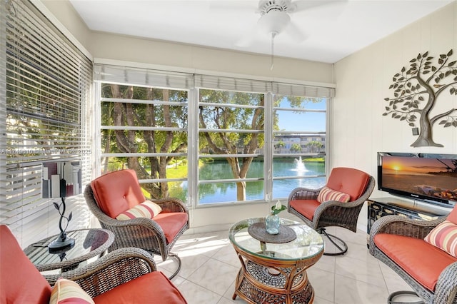 sunroom / solarium featuring a ceiling fan