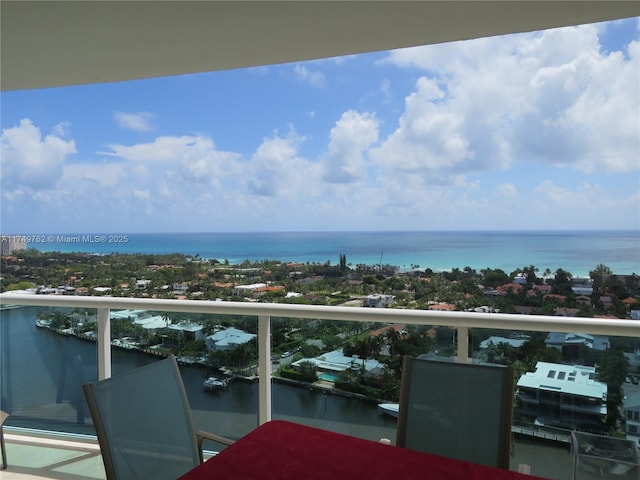 balcony featuring a water view