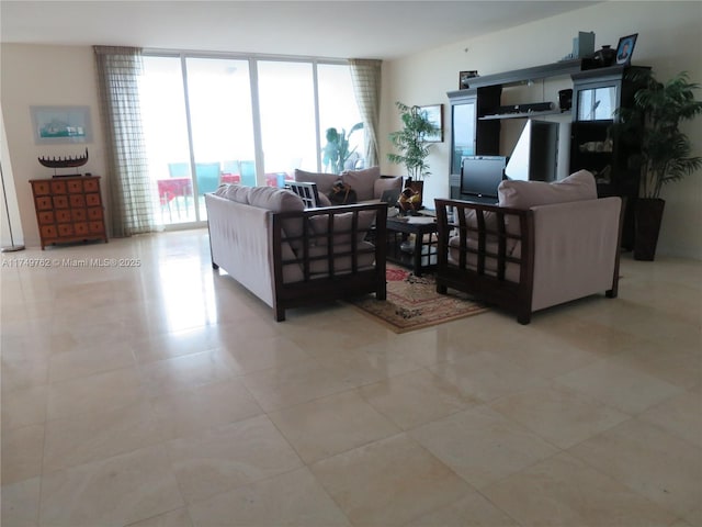 living area featuring light tile patterned floors and floor to ceiling windows