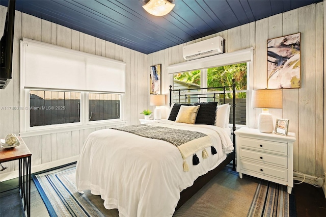 1109 NE 3rd St, Fort Lauderdale, FL 33301 - bedroom with a wall unit AC, wooden ceiling, wood walls, and dark wood-type flooring