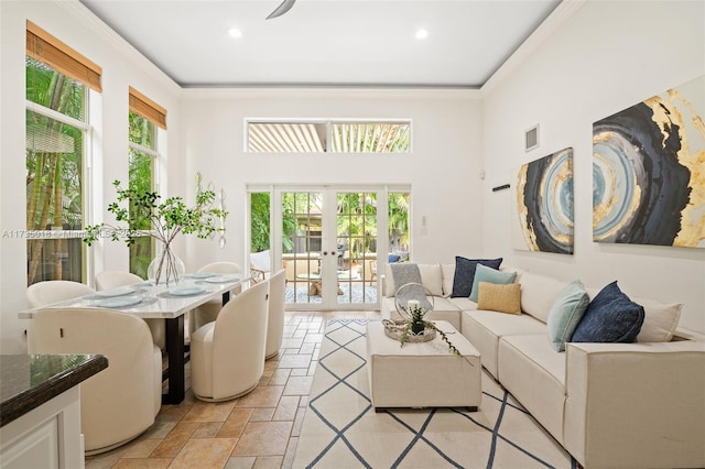 1109 NE 3rd St, Fort Lauderdale, FL 33301 - living area featuring plenty of natural light, visible vents, stone tile floors, and french doors