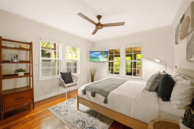 1109 NE 3rd St, Fort Lauderdale, FL 33301 - bedroom featuring baseboards, wood finished floors, ornamental molding, and a ceiling fan