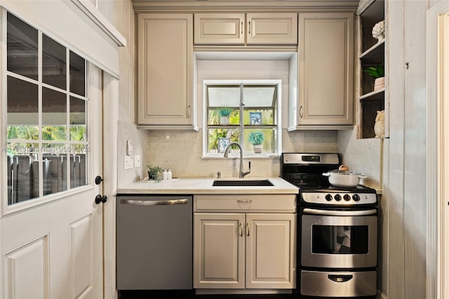 1109 NE 3rd St, Fort Lauderdale, FL 33301 - kitchen with decorative backsplash, light countertops, stainless steel appliances, a sink, and open shelves