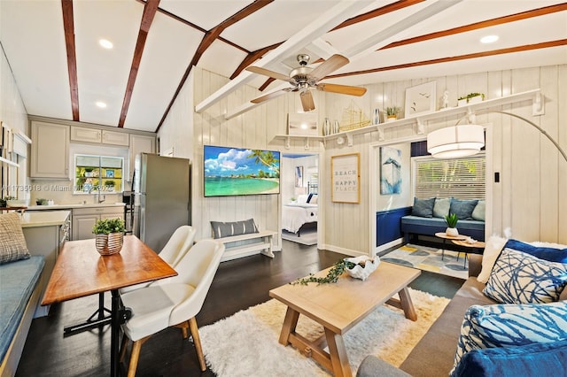 1109 NE 3rd St, Fort Lauderdale, FL 33301 - living room with lofted ceiling with beams, dark wood-style flooring, wood walls, and a ceiling fan