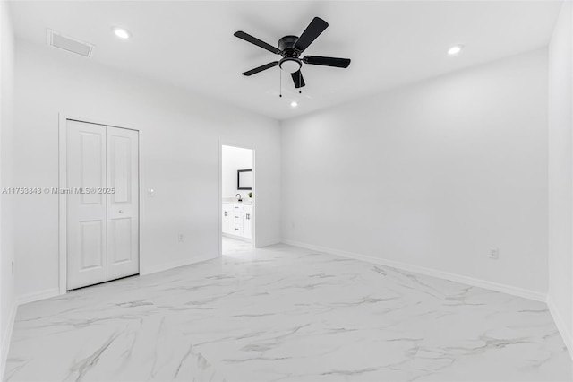 unfurnished bedroom with marble finish floor, baseboards, visible vents, and recessed lighting