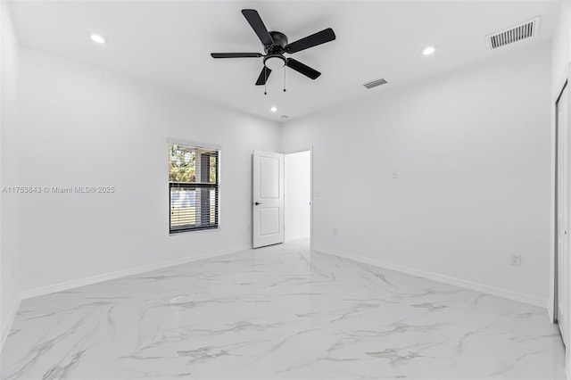 unfurnished room with recessed lighting, visible vents, and baseboards