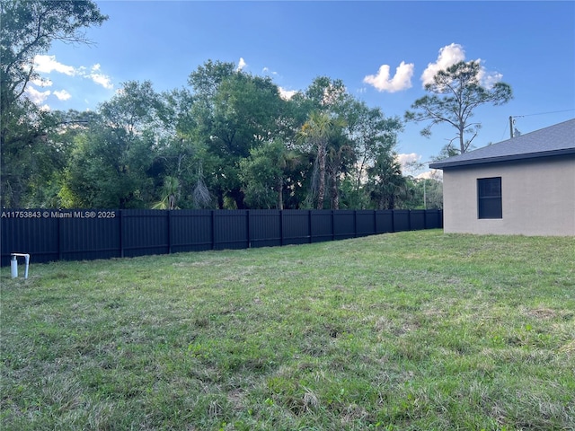 view of yard with fence