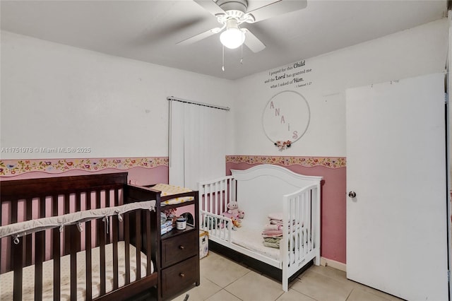 bedroom featuring a ceiling fan and light tile patterned floors